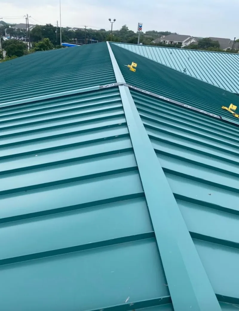 Green commercial metal roof ridge and valley for Metal Roof Repair in Saginaw